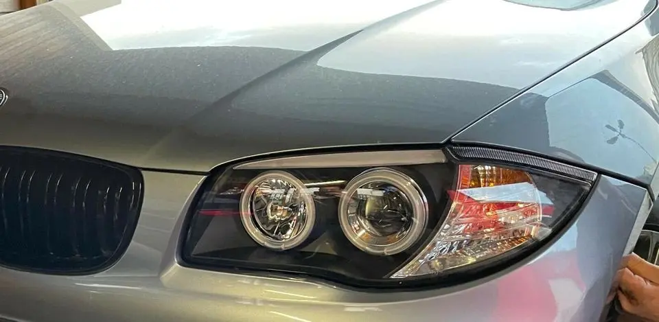 Frontlykter BMW 1 (E87/E81/E82/E88) 2004-2011 | Angel Eyes Black Image 10